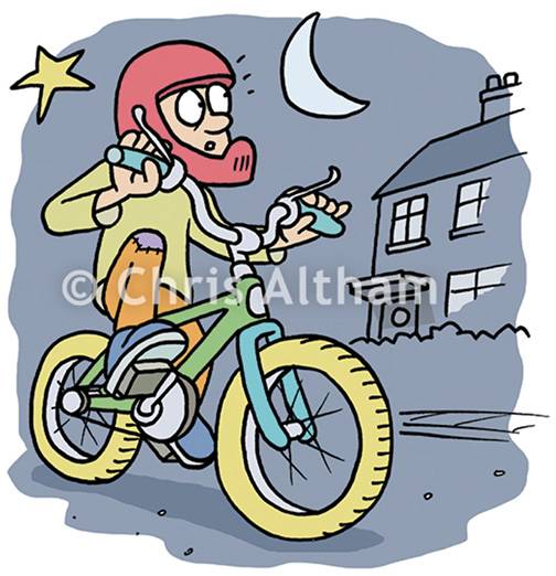 young child riding bike at night